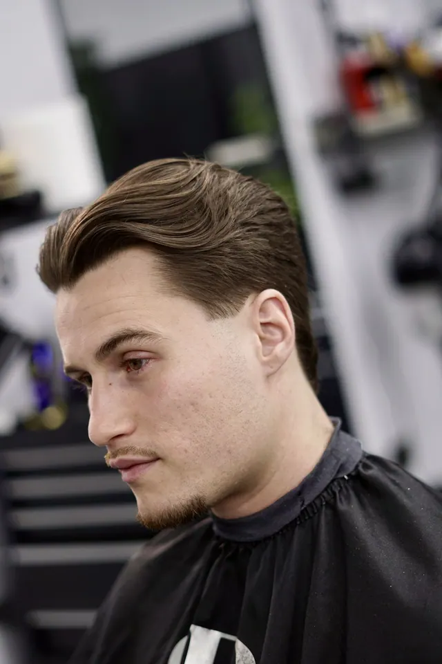 A swept-back cut with a taper